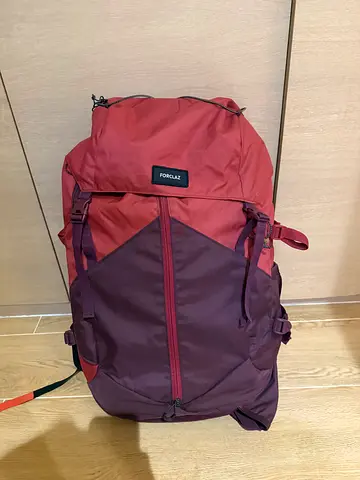 FORCLAZ barely used red/purple hiking and travel backpack – spacious, good condition
