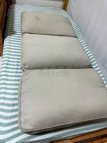 Three beige sofa seat cushions (used) - fits bench/sofa