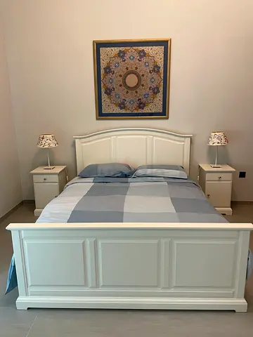 White kea queen size bed and 2 side table