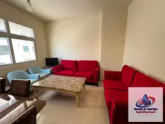 For annual rent in Sharjah, Al Qulaya area: a large bedroom with an open view, good ventilation and