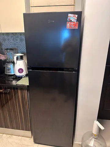 Black double-door refrigerator in good condition