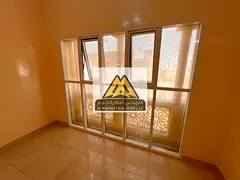A spacious one-bedroom apartment with a separate living room is available for annual rent in Al Mowa