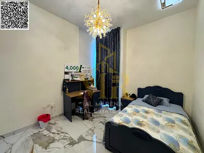 Luxury villa for sale in Al-Zawraa, large area, prime location, includes electricity, water, and air conditioning.