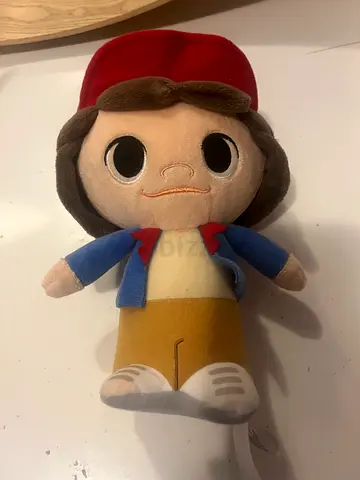 Small plush toy character with red hat - used