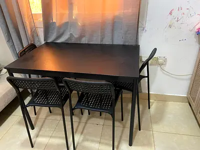Black dining table with 4 matching chairs - good condition