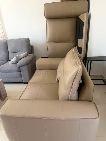 Beige leather sofa, six months old and still in like-new condition. Hardly used, with no pets or chi