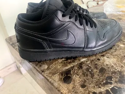 Black low-top Nike Jordon sneakers, lightly used