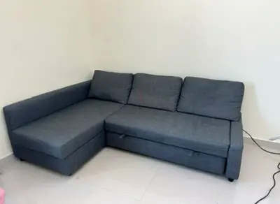 IKEA dark grey sofa-bed with storage