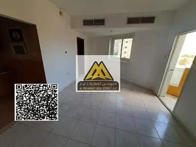 Studio in Al Rashidiya 3, Ajman, behind Grand Mall. Semi-separated kitchen, balcony, central AC, built-in wardrobes, AED 20,000 per year in 4 payments