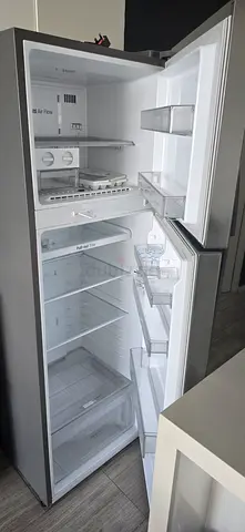 Tall single-door refrigerator with freezer compartment - good working condition