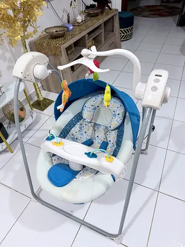 Used baby swing with toy mobile - good condition