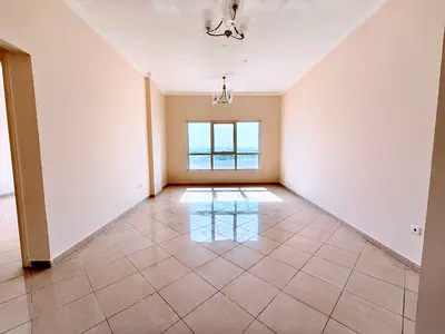Spacious 2BHK with big hall and open view window close to road and school easy exit to dubai