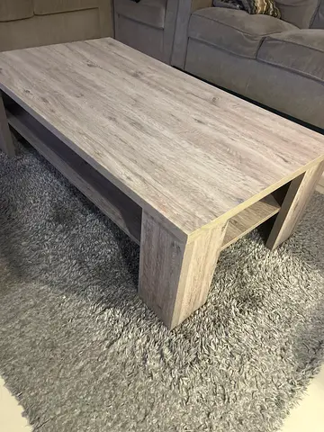 Light wood coffee table with lower shelf - good condition