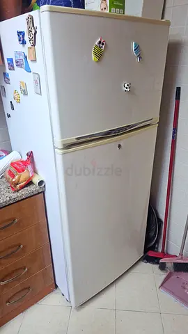 Used white top-freezer refrigerator - good working condition