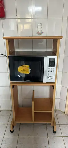 Compact wooden microwave trolley with storage shelves on wheels