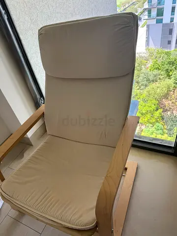 IKEA Poang Rocking Chair with beige cushion
