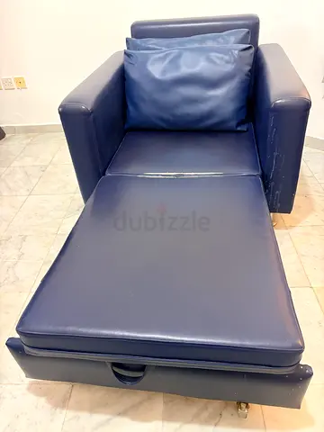 Blue vinyl reclining sofa cum bed