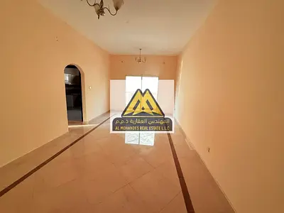 Two-bedroom apartment with a living room for rent in Al Nuaimiya 1, Ajman, near Al Hikma School, at a bargain price and with a large area.