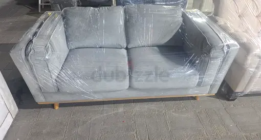 Light grey 2-seater fabric sofa in good condition