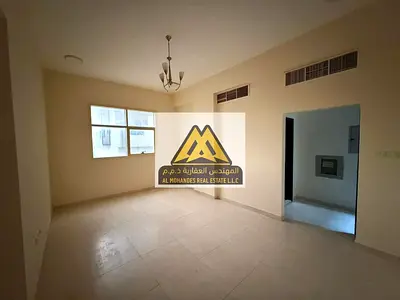 Two-bedroom apartment with central air conditioning and excellent natural lighting, close to the Dubai and Sharjah exit.
