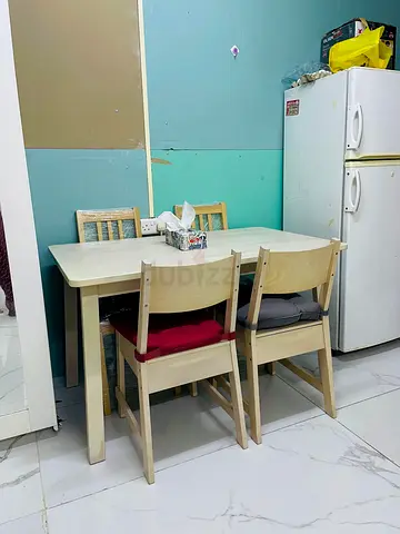 IKEA-style 4-seater dining table with chairs - light wood