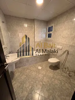 two bedroom apartment with a living hall in excellent condition for rent in Al Khan