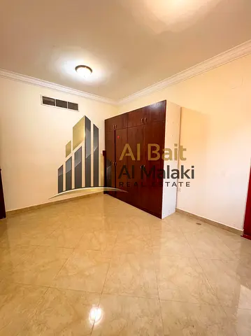 two bedroom apartment with a living hall in excellent condition for rent in Al Khan