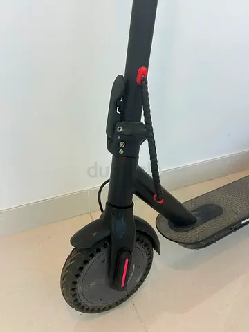 Electric kick scooter (front view) - used