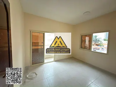 Two-bedroom apartment for annual rent in Al Nuaimiya 2, Ajman – Lowest prices and prime location