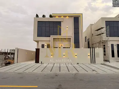 Villa for sale with a distinctive modern design | Registration and ownership fees included | Close to Mohammed Bin Zayed Road and Emirates Road | Clos