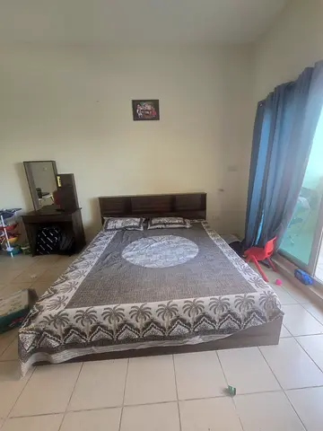 King-sized bed frame with headboard and mattress (used)