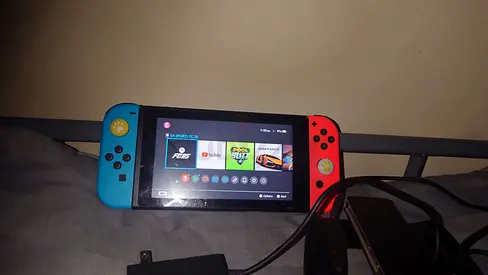 Nintendo Switch   with charger or fc 25 game or 512 gaming SD card