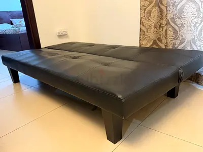 Compact black faux-leather 3-seater sofa bed (good condition)