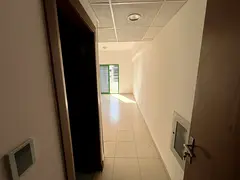 Studio apartment with balcony for annual rent in Al Amrah, near Mohammed Bin Zayed Road, Emirates Ci