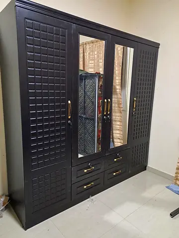 Large dark wooden 4-door wardrobe with mirrors and drawers