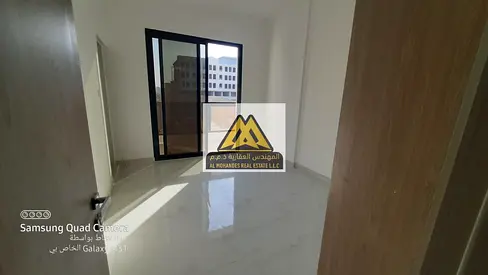 1-bedroom apartment in Al Alia, Ajman. New building, 2 bathrooms, balcony, built-in wardrobes, central AC. AED 33,000 yearly, 4 payments, prime locati