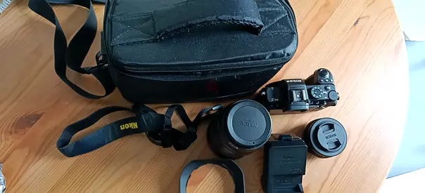 1. Nikon Z50ii Mirrorless 2. Nikon DX 16-50mm Lens 3. Nikkor Z 28-400mm VR Lens 4. Nikon Battery Cha