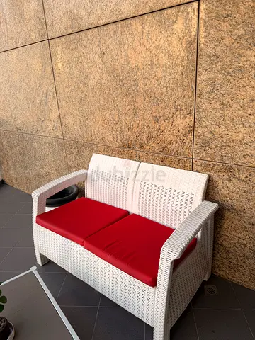White Wicker Two-Seater Outdoor Sofa with Red Cushions