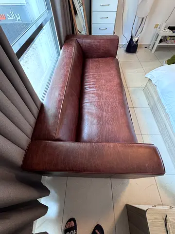 Comfortable brown leather sofa from Home Center for sale