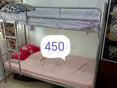 Metal Bunk Bed with Ladder — Good Condition, Ready to Use (Price: 450 AED)