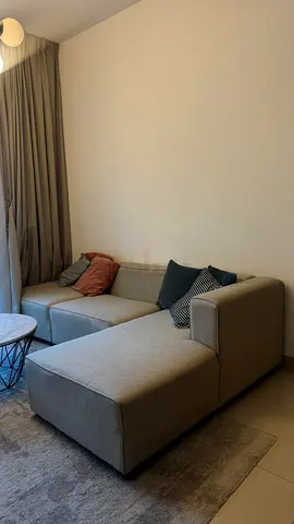 Light grey L-shaped sofa with chaise - good condition