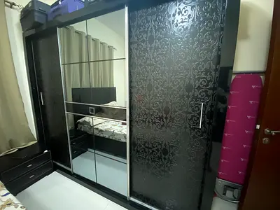 Black Sliding Door Wardrobe with Mirror and Patterned Panels