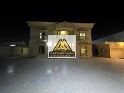 Villa for rent in Al Rawda, Ajman, residential/commercial, large space, 11 rooms, spacious yard and front setback, prime location near services with e