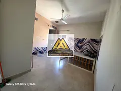 Studio for rent in Al Rawda, Ajman, spacious, semi-separate kitchen, central AC, prime location near