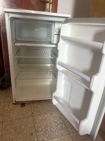 Compact single-door refrigerator with small freezer, used