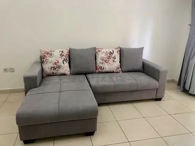 Light grey L-shaped sofa with chaise - good condition