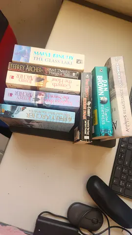 Mixed fiction paperback lot including Jeffrey Archer, Dan Brown, Mary Prince AED 160 FULL SET
