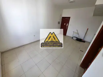 Studio apartment for annual rent in Al Rawda 1, Ajman. Spacious with balcony and excellent view. Central air conditioning.