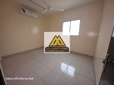 For annual rent: A two-bedroom apartment with a living room in Al Rawda 1, Ajman. Located in a prime location near the Dubai exit and close to Al Hami