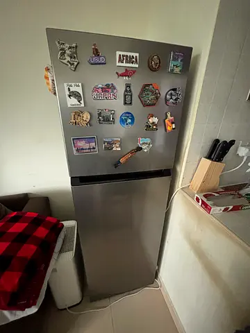 Small stainless steel single-door fridge in good working condition